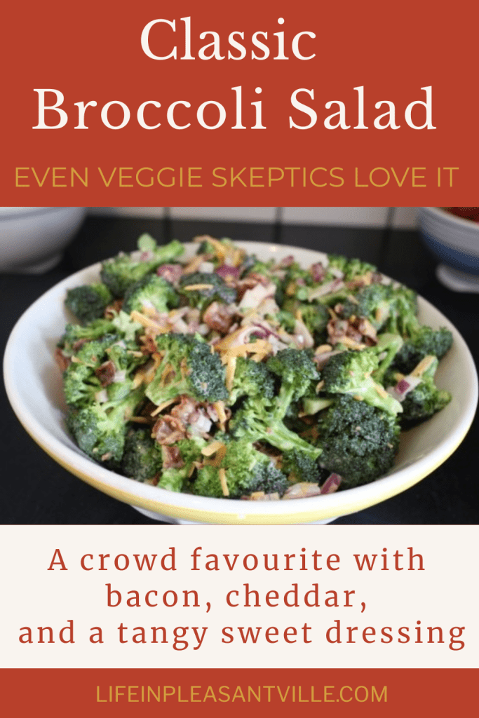Bowl of classic broccoli salad made with chopped broccoli, crispy bacon, shredded cheddar, and red onion, tossed in a creamy dressing.