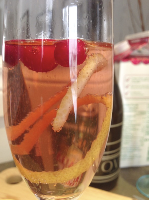 A sparkling wine, cranberry juice, and ginger ale holiday cocktail.
