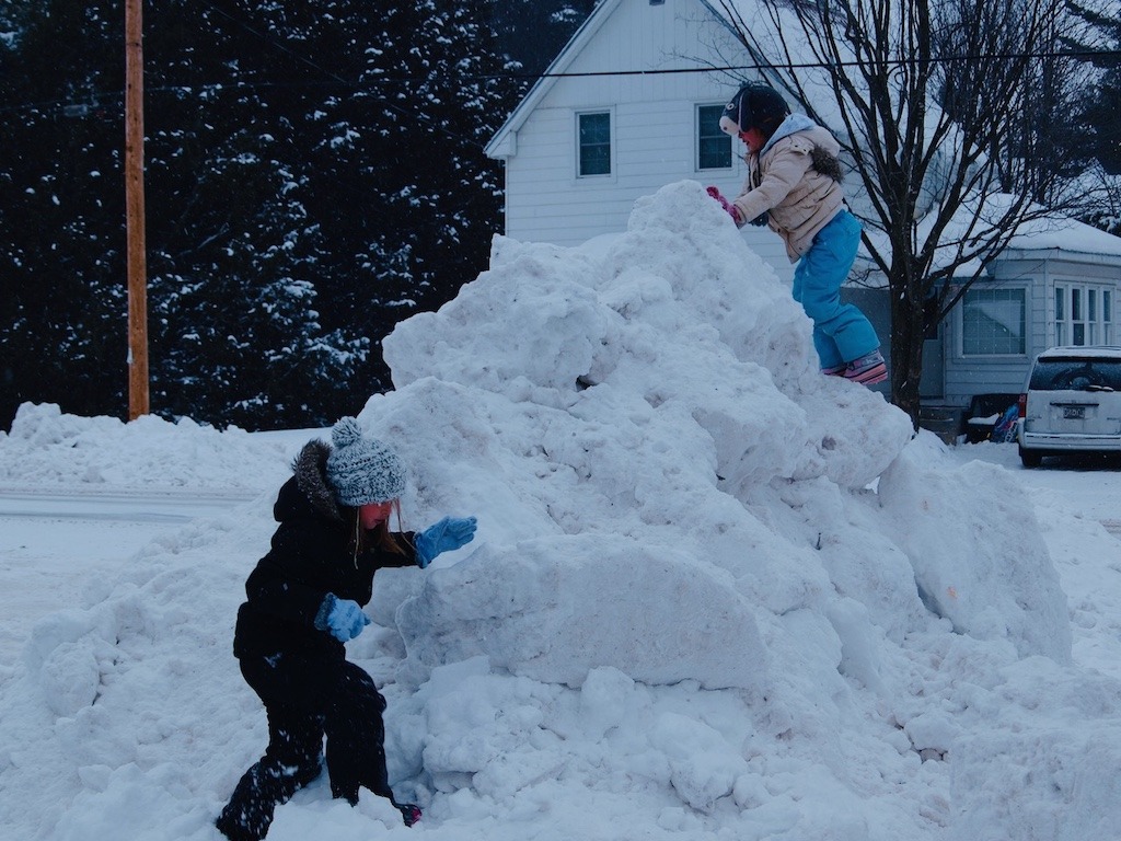 Playing on a snow hill after a storm