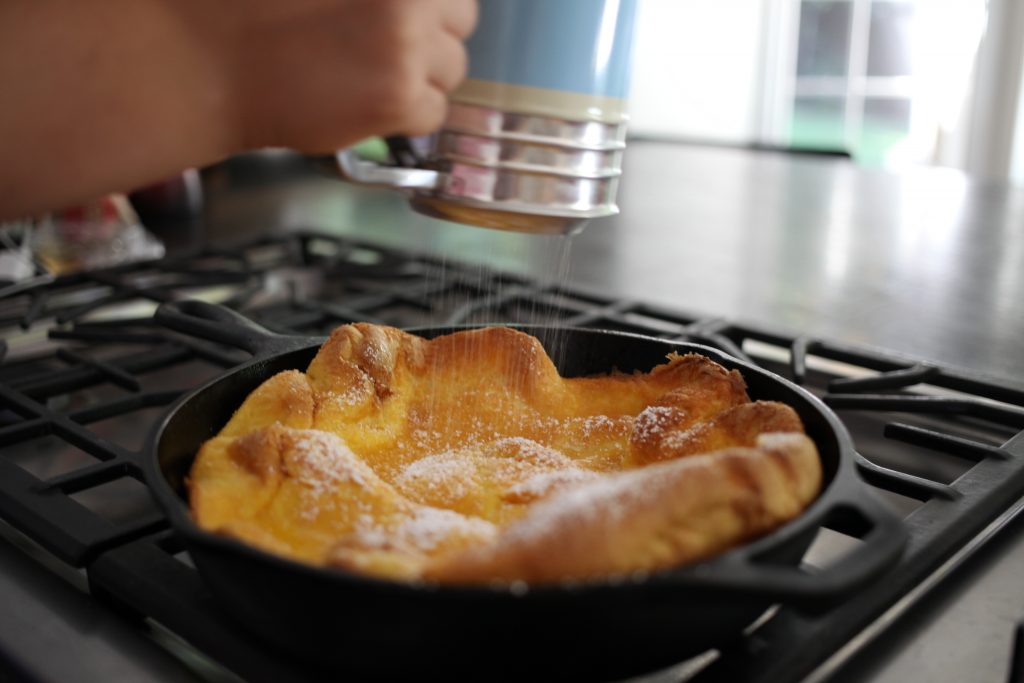 Sprinkle powdered sugar over Dutch Baby for a sweet breakfast treat. 