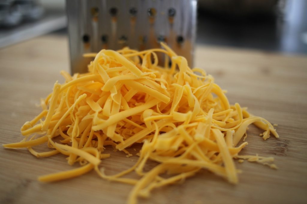 Cheesy make ahead mashed potatoes, grated cheese