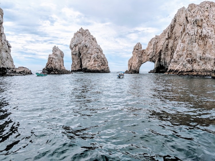 Canexican Tour stops for a great photo opp at the Archway of Cabo San Lucas.