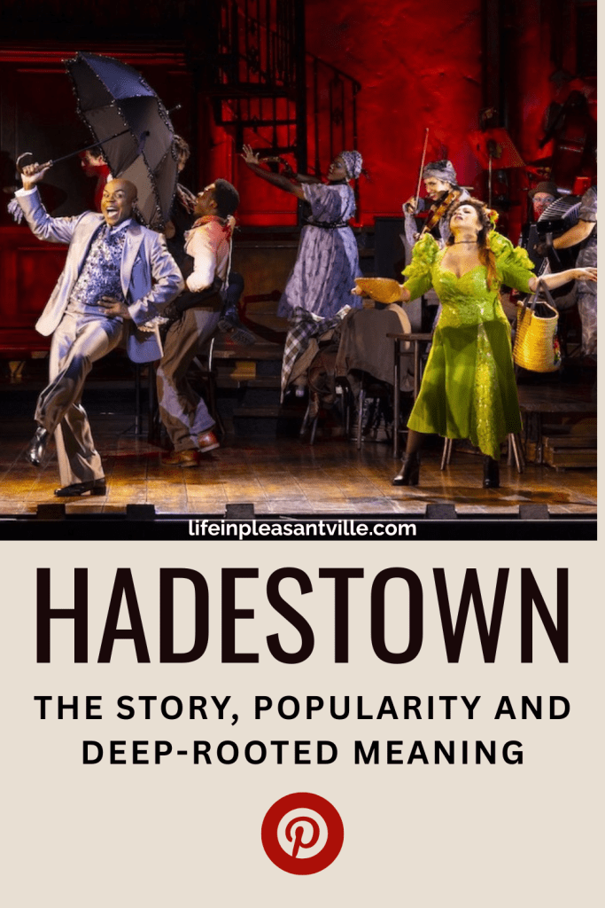 Cast of Hadestown performing a high-energy number during the North American Tour, showcasing vibrant stage design and key characters from the musical.