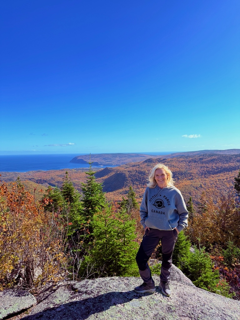 Cape Breton Highlands view with fall colours and ocean.