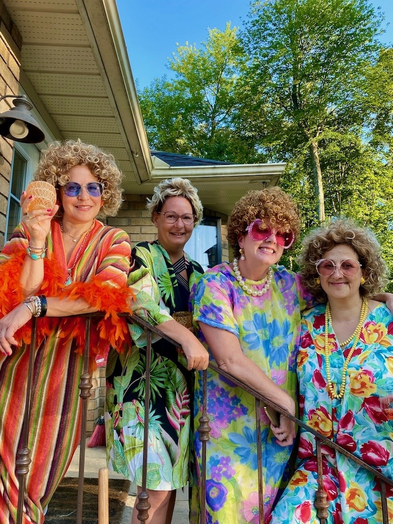 Friends dressed up in retro caftans for Mrs. Roper Party