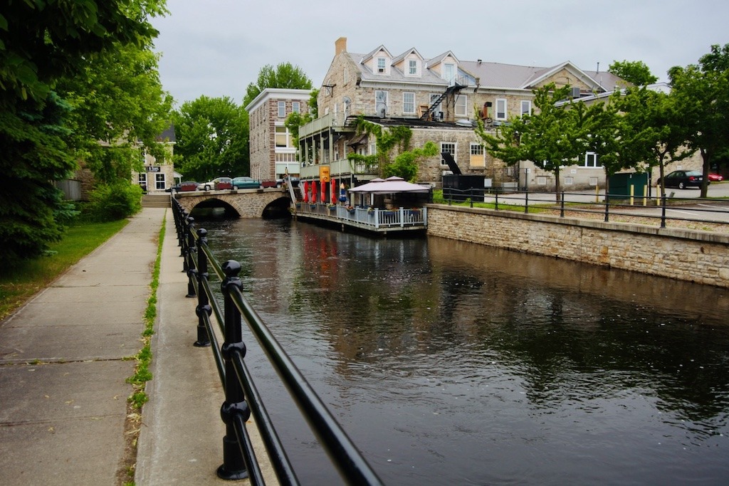 Historic stone buildings and riverside patios in Perth, Ontario