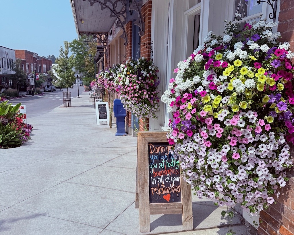 Mill Street in Almonte, Ontario in summer with colourful hanging flower baskets