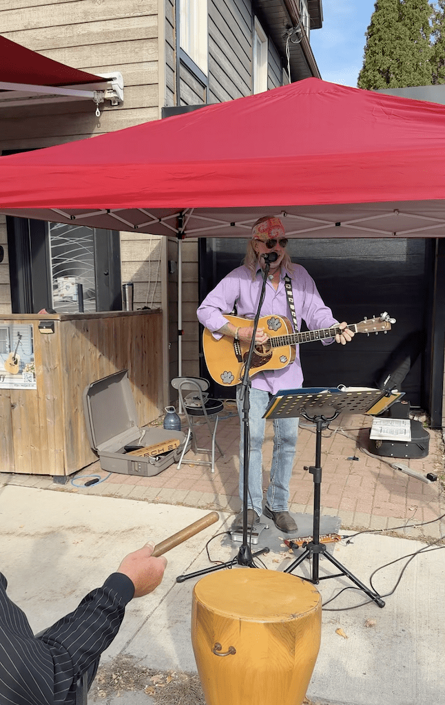Porch-side music and visitors enjoying Westporch in Westport, Ontario
