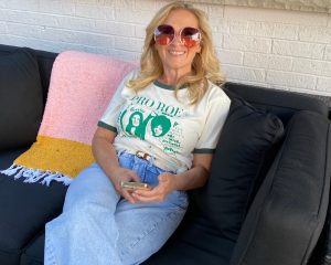 Gen X woman smiling in a Pro Roe t-shirt, done being angry and choosing joy instead