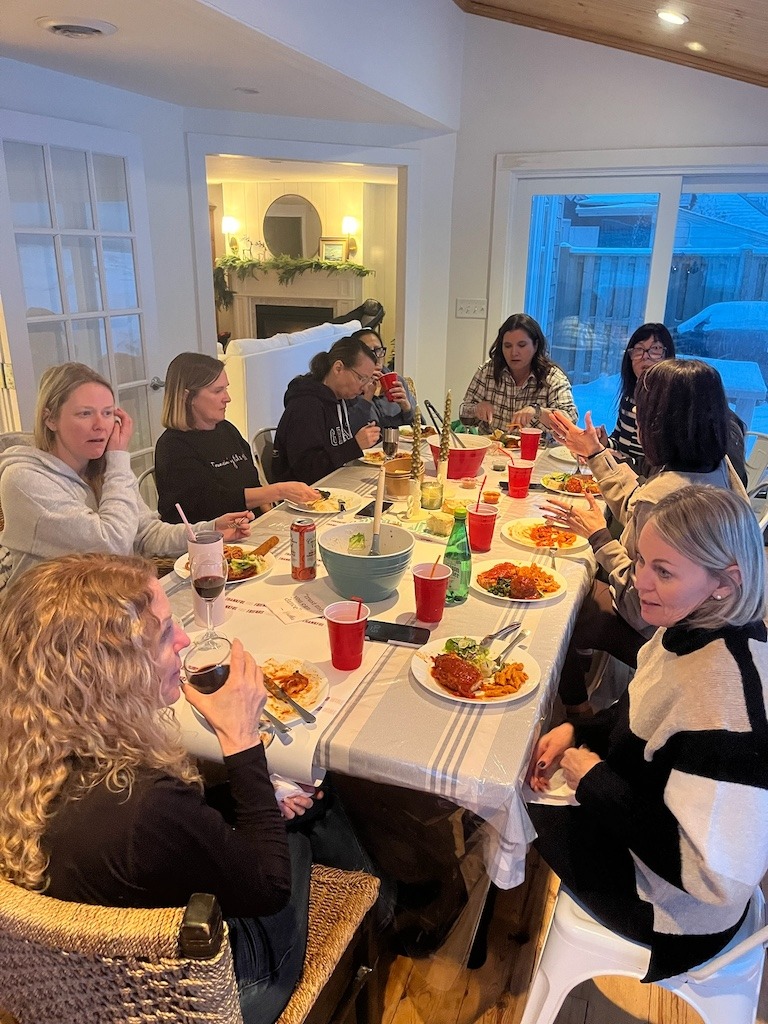 Friends enjoying takeout from Rizzo’s House of Parm