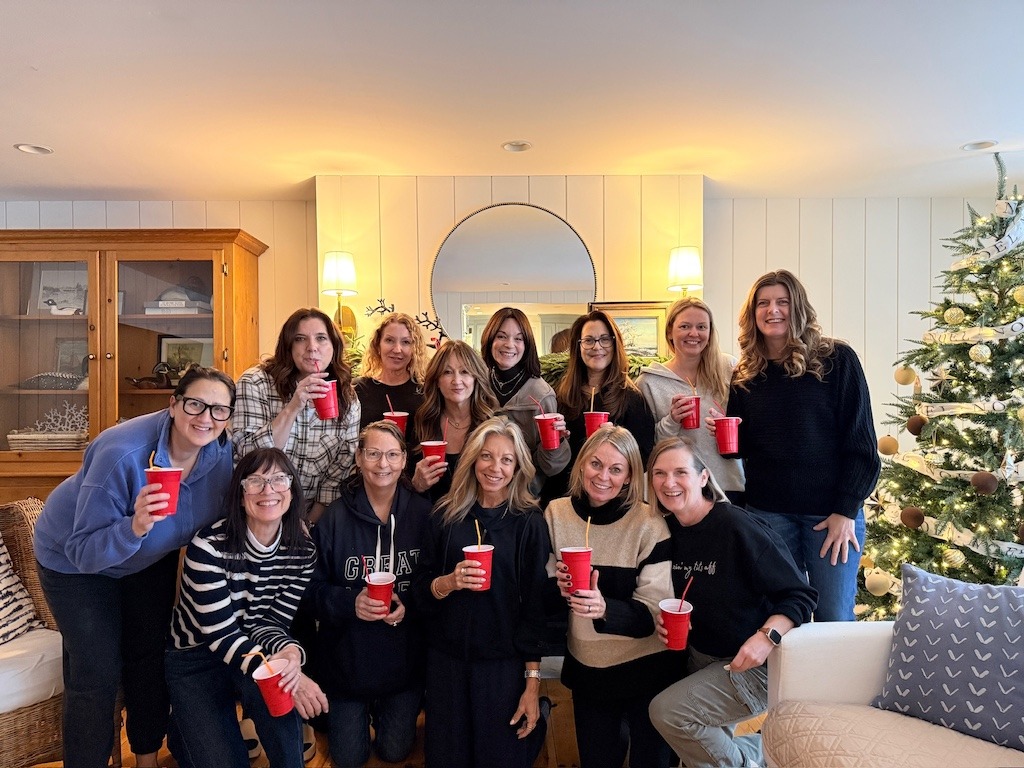 My friends and I enjoying drinks together inside our rental home during a Crystal Beach winter getaway