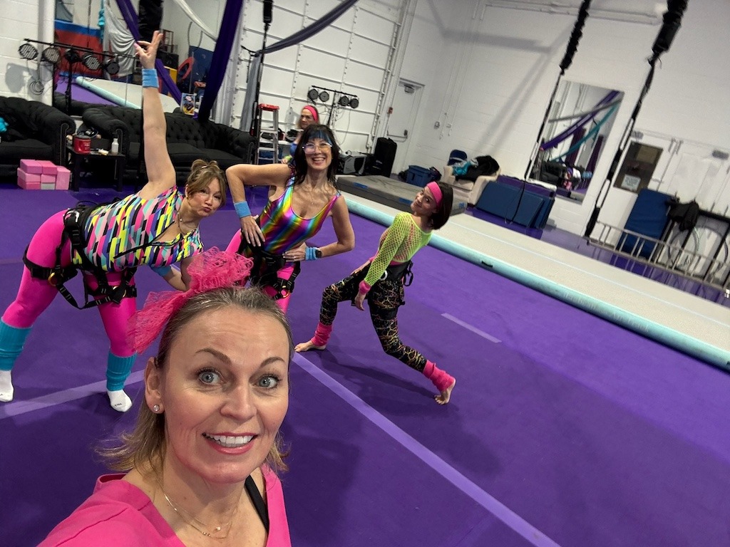 Women in 80s-inspired workout outfits during a Crystal Beach Ontario winter girls weekend activity