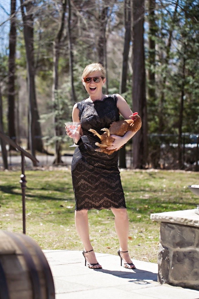 Gen X women juggling it all: dressed for a gala while holding a backyard chicken, because of course