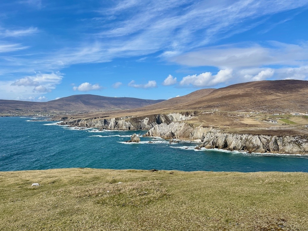 No Ireland road trip itinerary is complete without seeing the dramatic sea cliffs and turquoise Atlantic water along the coastline of Achill Island, County Mayo, Ireland.