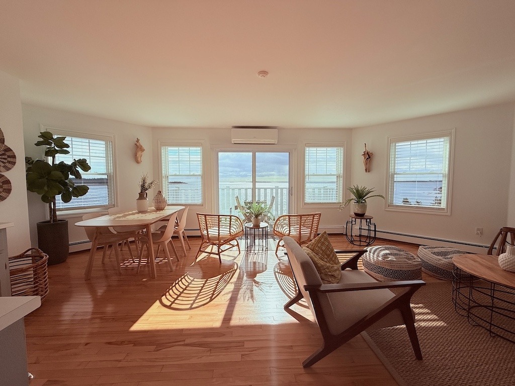 Spacious sun-drenched suite living room at North Star in Cape Breton with panoramic ocean views through large windows