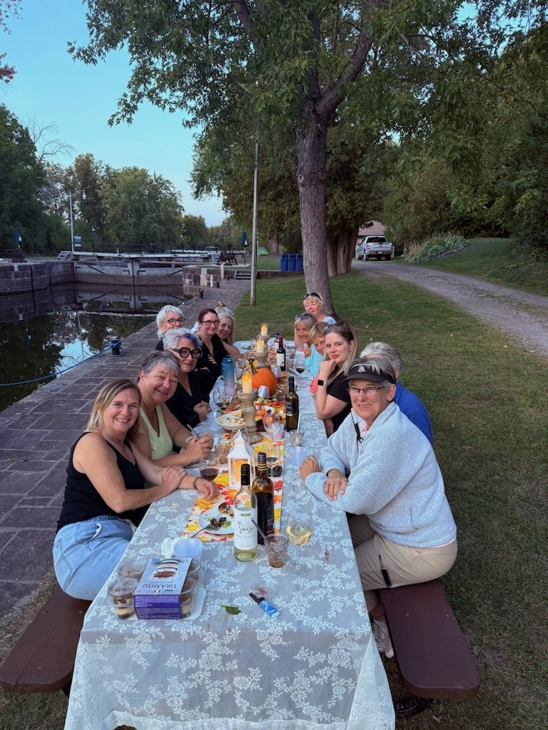 women having dinner on a warm summer's eve along the Rideau Canal 