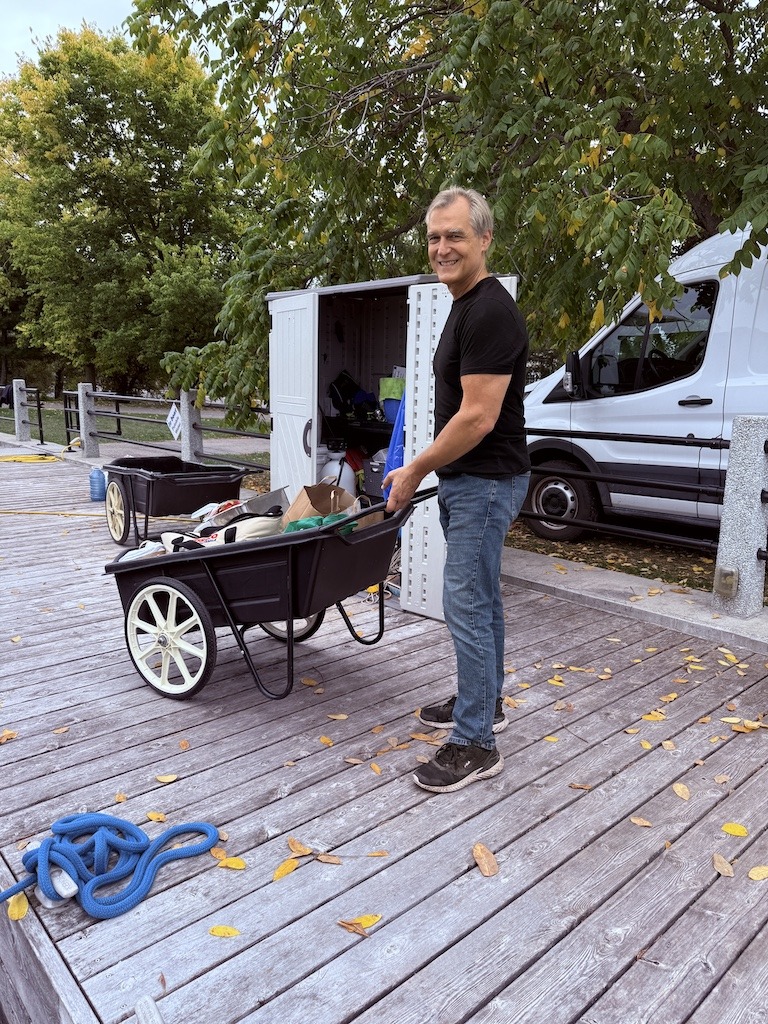 A man helps a woman set up for a women's retreat