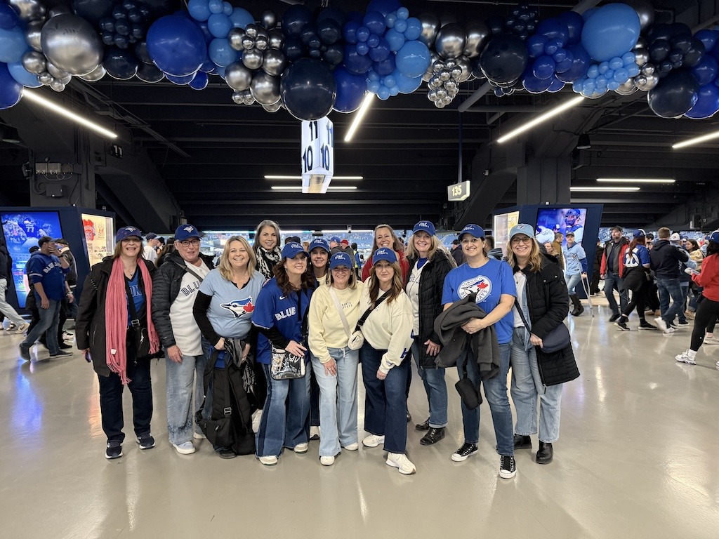 why do women travel in groups to sporting events