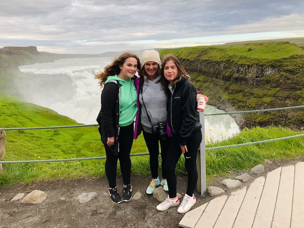 Mother and two daughters at Gullfoss waterfall in Iceland