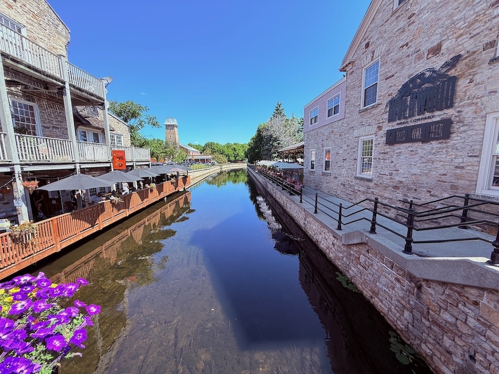 The Tay River running through historic downtown Perth Ontario with waterfront patios