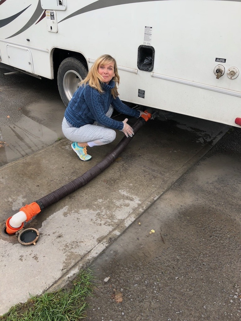Woman emptying RV septic tank at Ontario Parks campground