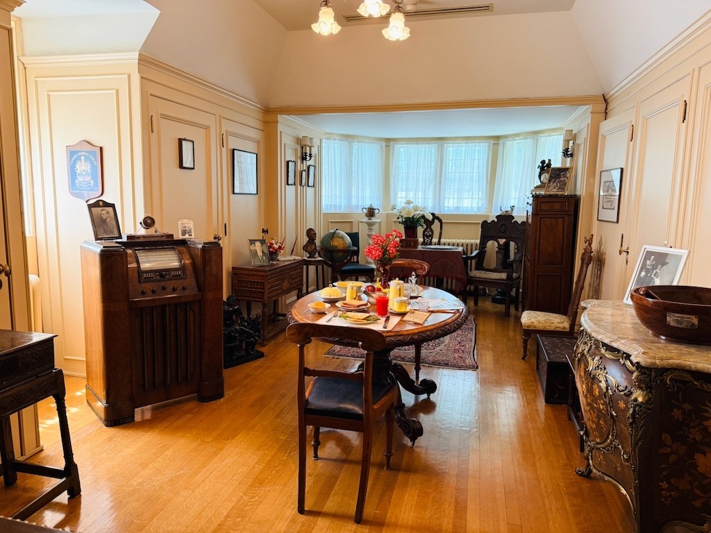 Mackenzie King breakfast room at Laurier House Ottawa with period radio and table set for breakfast