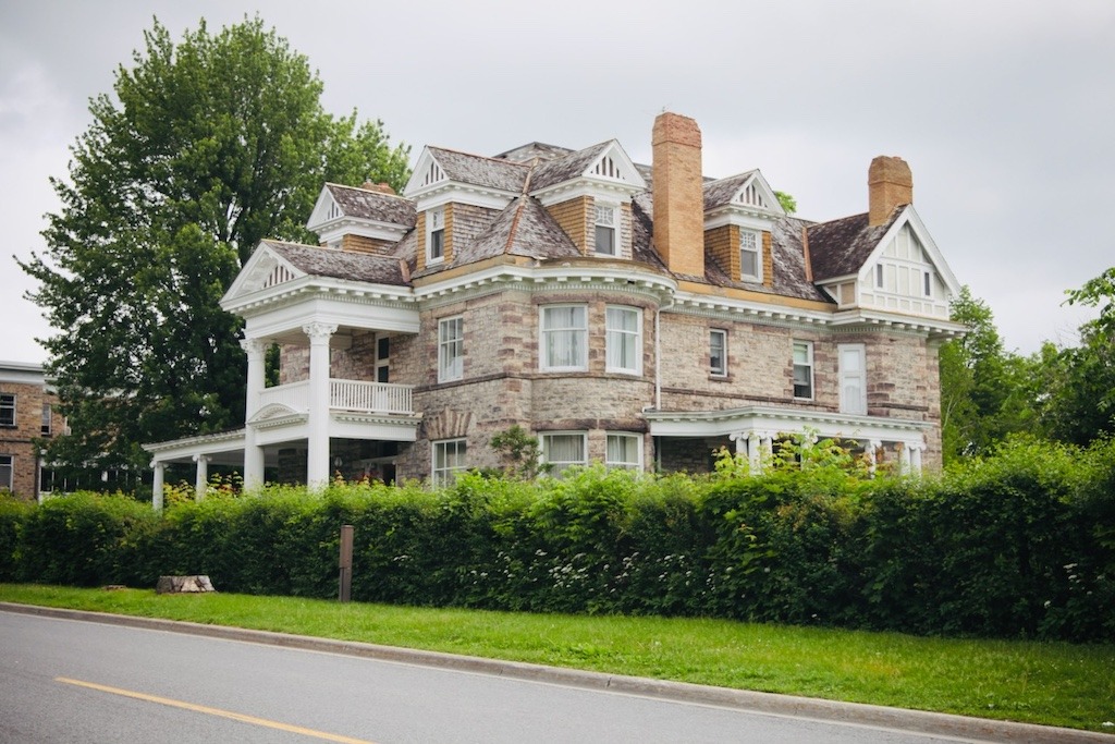Historic Victorian stone heritage home on a residential street in Perth Ontario