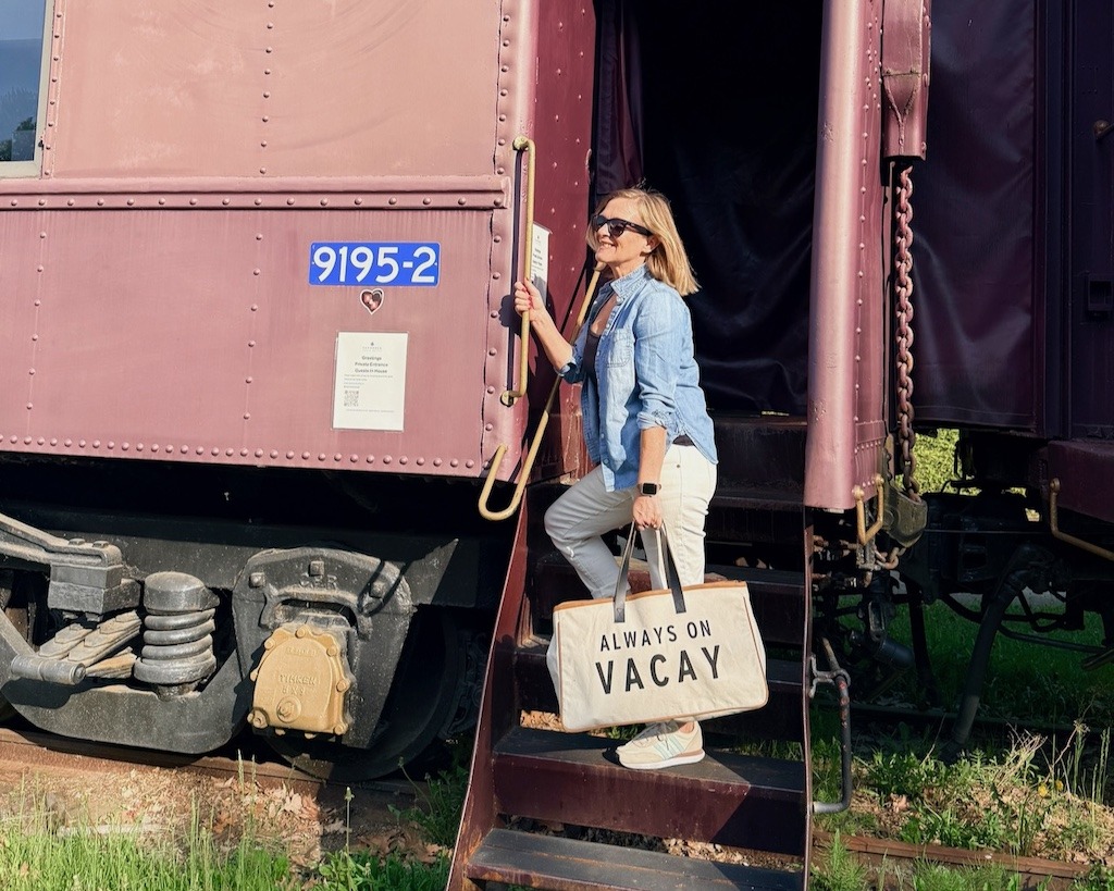Standing on the restored train car part of Shamrock Suites