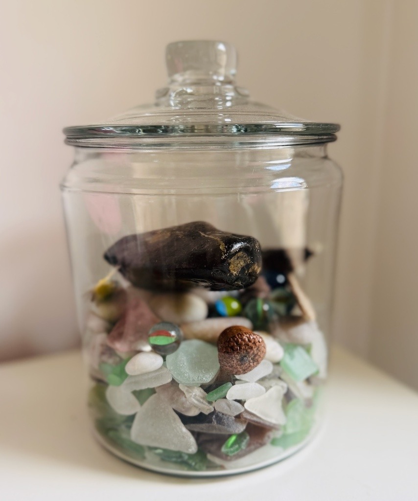 Jar of sea glass Cape Breton collection with sea pottery and beach stones